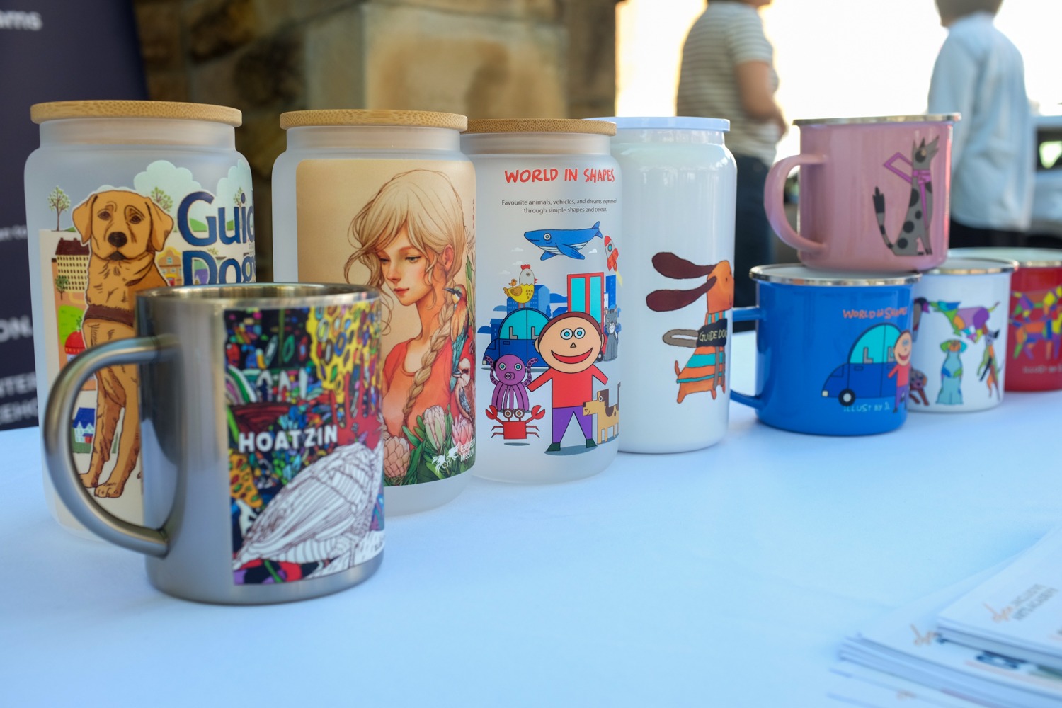 Mugs and tumblers featuring original artwork by artists with disability