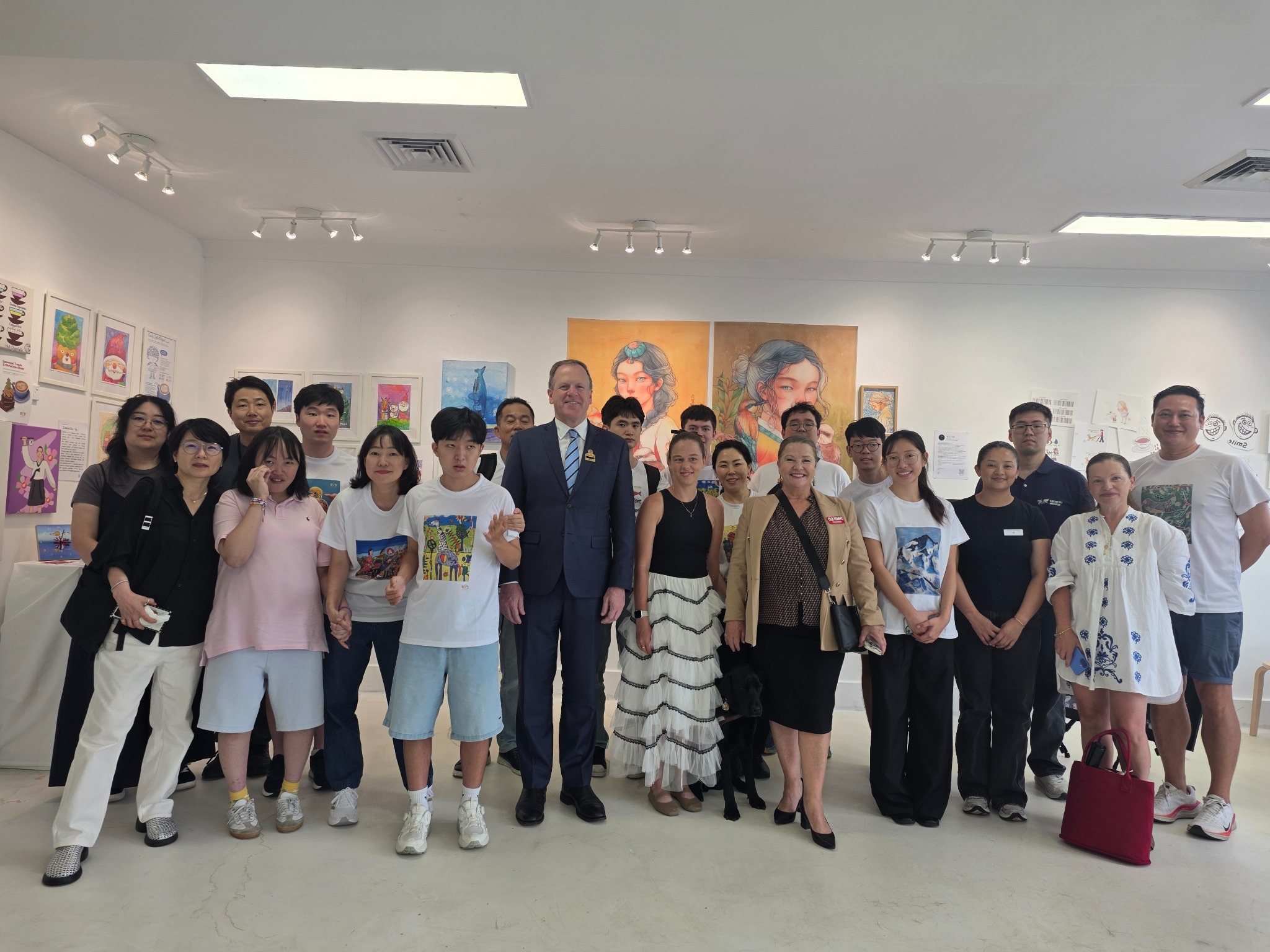 Artists and guests at an inclusive community exhibition