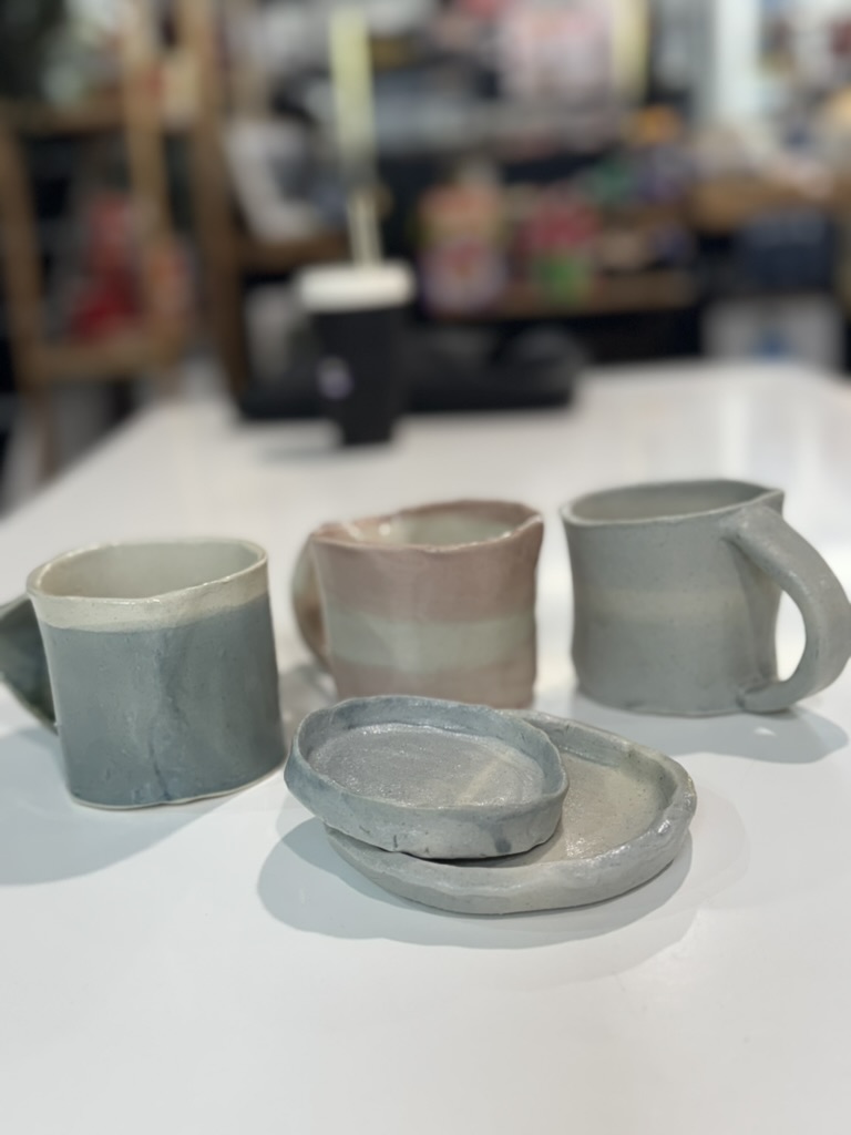 Handmade ceramic cups and dishes created by artists with disability