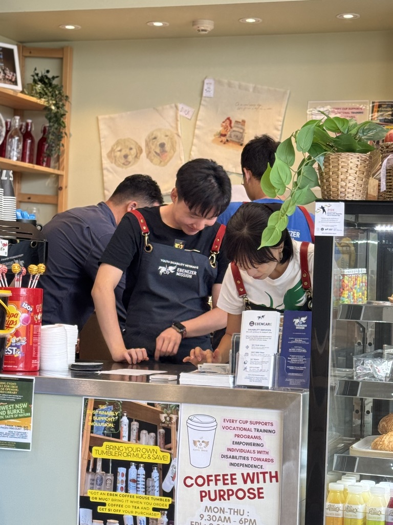 Eben Coffee House team members working together at the counter