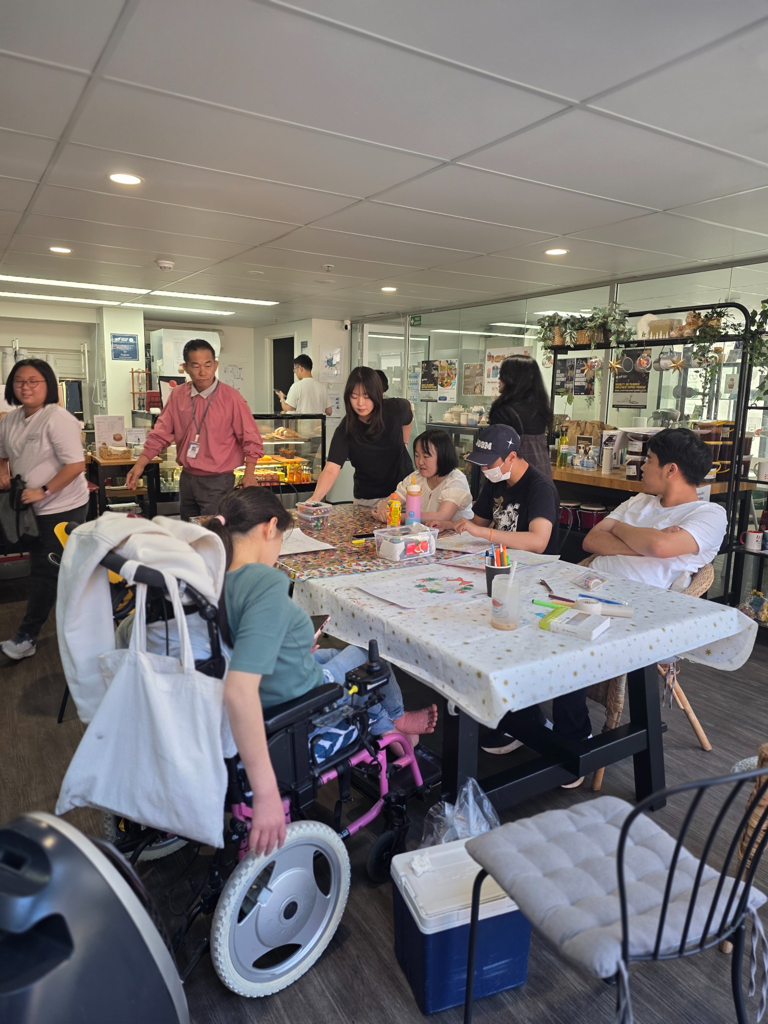 Participants taking part in a shared drawing and creative activity at the Ebencare Day Program