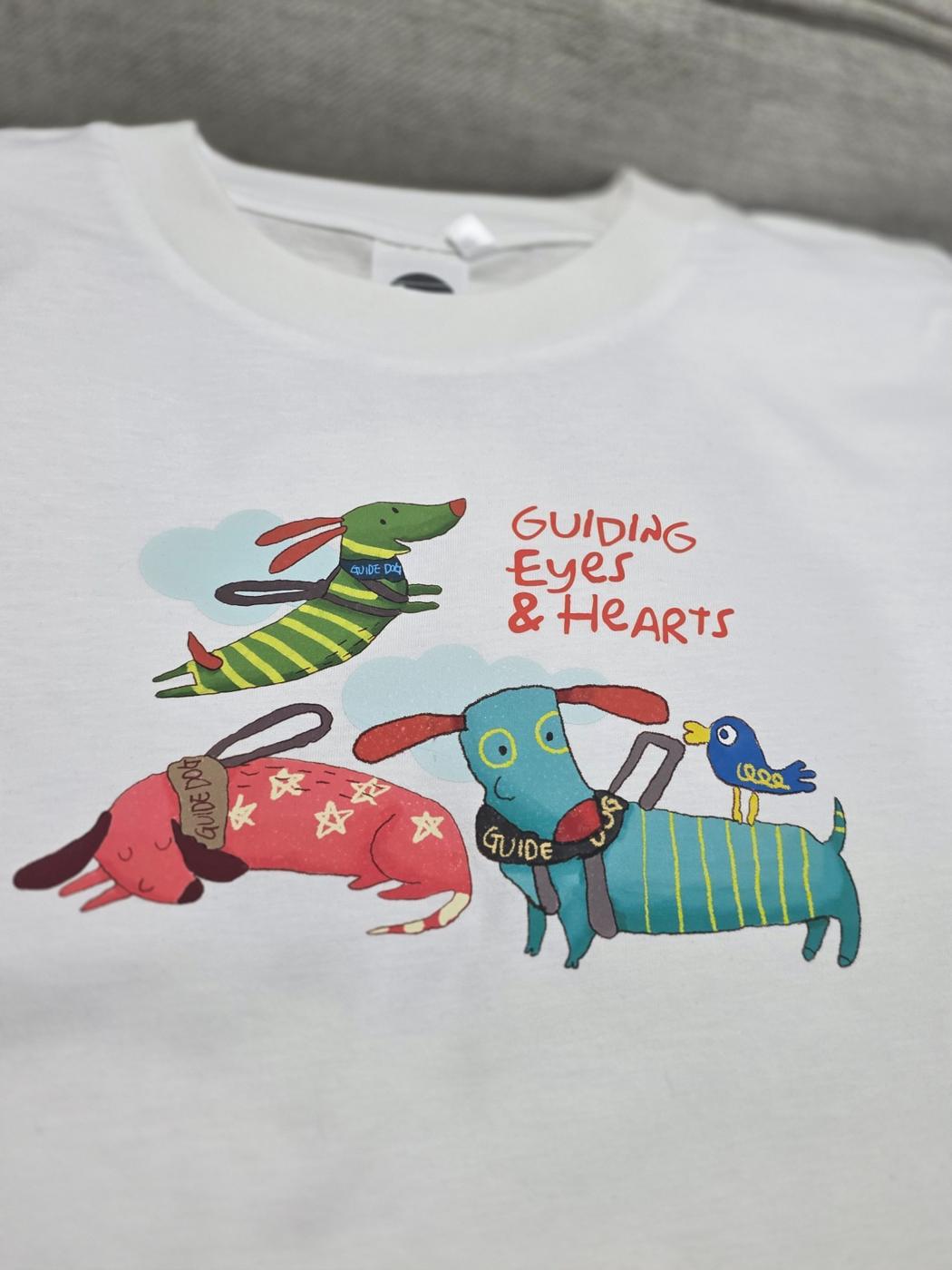 Guide dog illustration by an artist with disability on a finished T-shirt