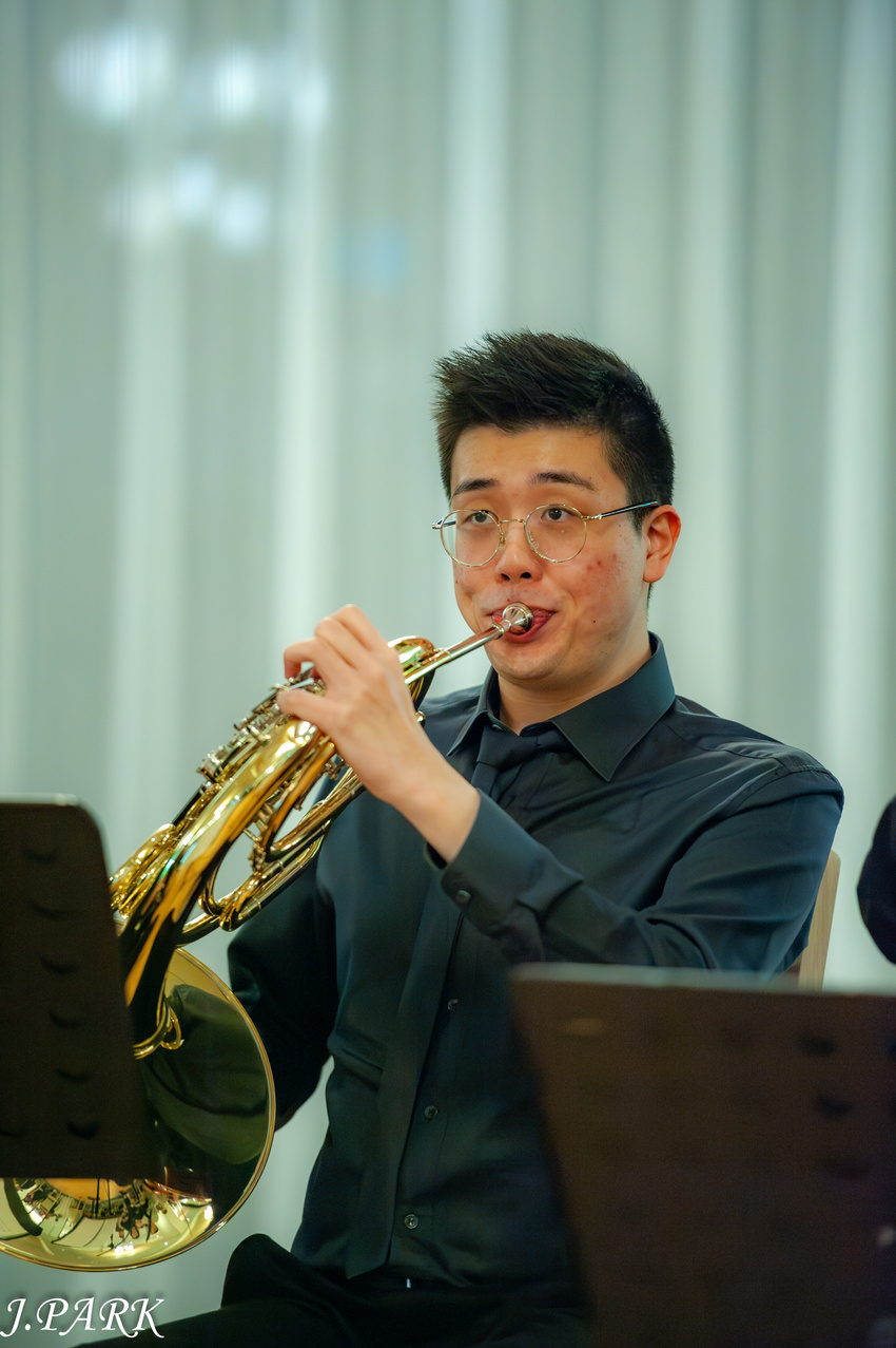 James Yoon performing on French horn