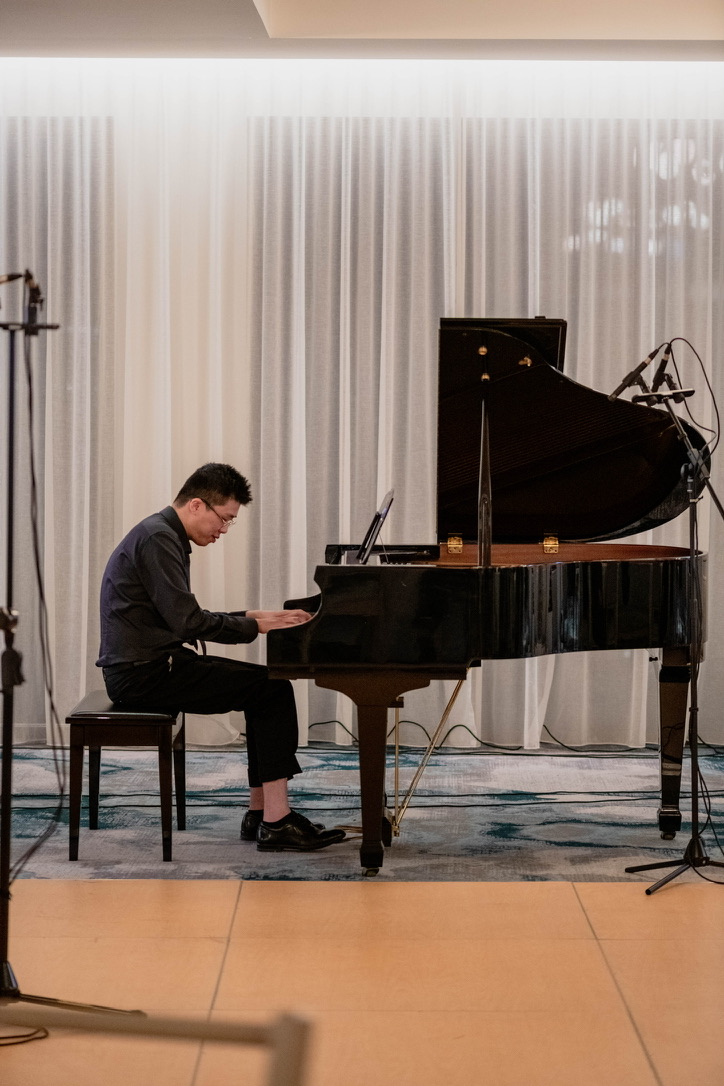 An autistic pianist performing at an Ebenezer Mission concert